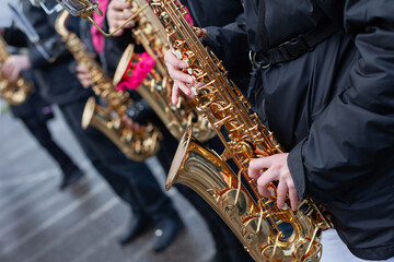 People playing saxophone in the street