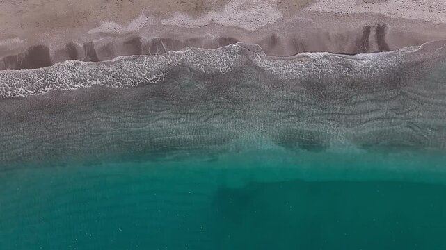 Aerial View of Turquoise Waves and Sandy Beach in Vietri sul Mare, Italy