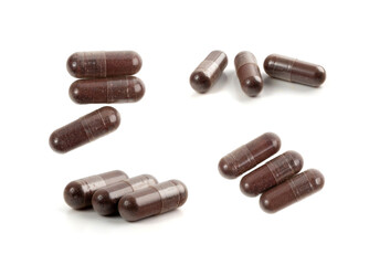 Iron capsule isolated, Fe pills, brown hemoglobin supplement tablets, vitamin capsules on white