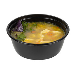 A black bowl filled with soup on a white background