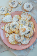 Linzer cookies with heart with raspberry jam 