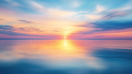 A soft blur of a sunset over a calm sea, with pastel colors reflecting on the water's surface, creating a peaceful scene.