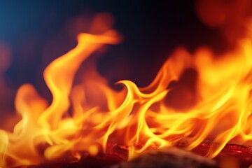 Fototapeta premium Fiery flames dance in dark hearth, background blurred