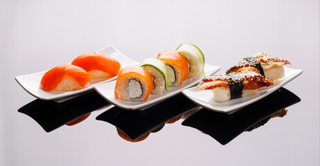 Assorted sushi and maki rolls beautifully arranged on plates