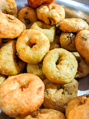 Close-Up of Golden Fried South Indian Medu Vada in a Serving Bowl