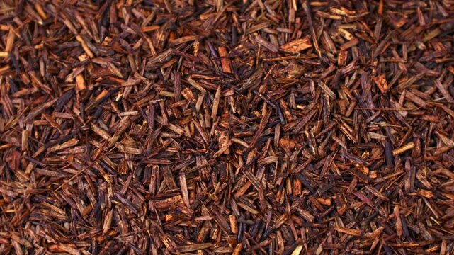 Rooibos tea dried leaves texture circle rotation close up