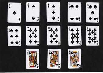 A montage of vintage playing cards in the same suit.