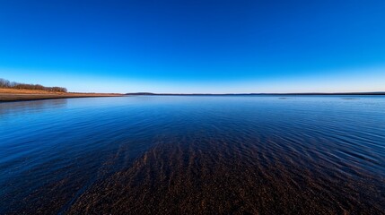Vast expanse of blue water reflecting the endless sky horizon beauty