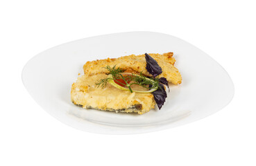 A white plate with fried fish and vegetables on a white background
