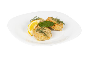 A white ceramic plate with crispy fried food and a lemon slice