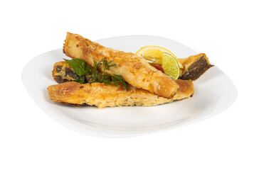 A white plate topped with golden fried fish and fresh lemon