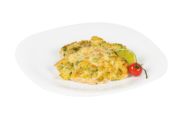 A white plate is topped with food and a fresh tomato beside it