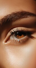 High-resolution image of a woman's eye, emphasizing eyebrow shaping and lash extension details.