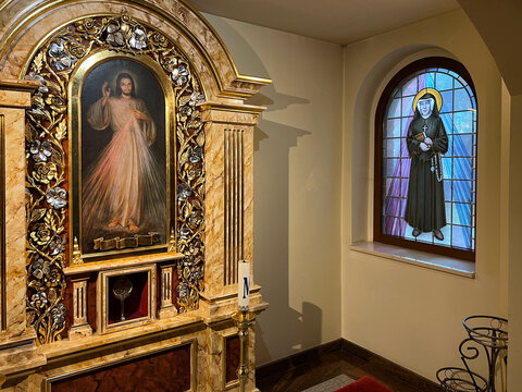 Kalety, Poland, December 19, 2024: The chapel of Merciful Jesus in the church of St. Francis of Assisi . The image of Merciful Jesus and the relics and stained glass window of St. Faustina Kowalska