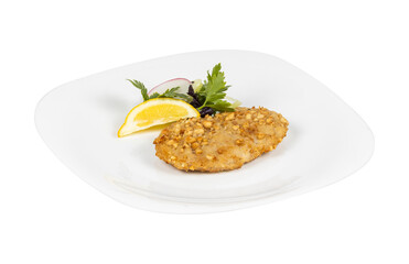 A white plate topped with meat and a fresh lemon slice