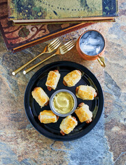 sausage rolls served with mustard dipping sauce