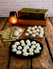 baby meringues served on a black plate