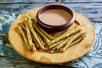 asparagus fritter sticks with a spicy dipping sauce