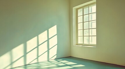 Fototapeta premium Sunlight streams through window in empty room.