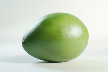 Obraz premium A Single Green Sphere Rests On A White Background