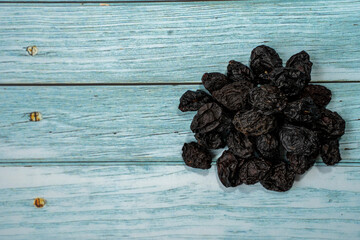 Nuts and dried foods in pile on wooden board
