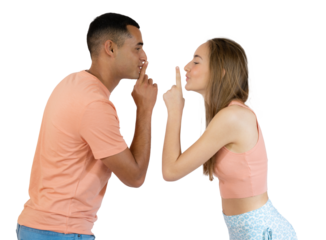 Young couple smiling with silence gesture or keep secret over transparent background. PNG transparent