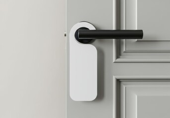 Elegant gray door with black handle and blank white door hanger for customization