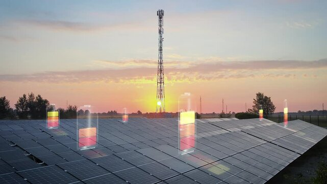 Solar power plant with hundreds of panels in front of a telecommunication tower at sunset. Digital battery icons overlay the scene, symbolizing energy generation, storage, and green technology