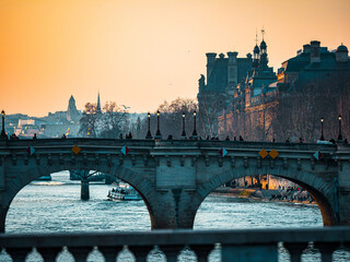 Sunset over the Seine in Paris. Silhouettes of bridges.
