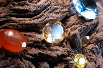 Beautiful shiny colorful gemstones on stone, closeup