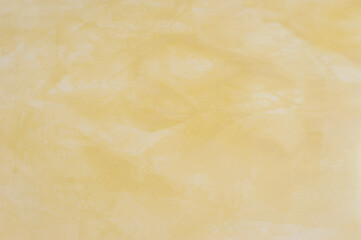 Golden warm Venetian, a glossy marble plaster, creates a marmorino effect with a shine