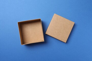 Open cardboard box on blue background