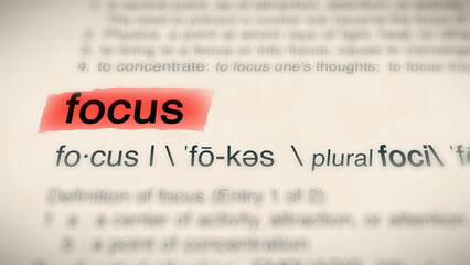 A close-up illustration of the word "focus" in a dictionary, showing its definition and meaning