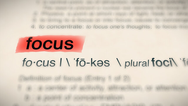 A close-up illustration of the word "focus" in a dictionary, showing its definition and meaning