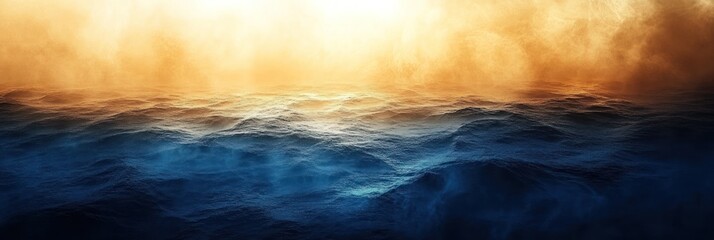 Obraz premium Abstract ocean scene with golden and blue hues, misty atmosphere.