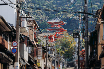 Naklejka premium Kiyomizu-dera buddhist temple in Kyoto prefecture, Japan, Higashiyama ward, autumn fall view with mountains, Kyoto streets and skyline, shrine and pagoda, travel to Japan, Kansai region