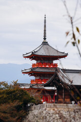 Naklejka premium Kiyomizu-dera buddhist temple in Kyoto prefecture, Japan, Higashiyama ward, autumn fall view with mountains, Kyoto streets and skyline, shrine and pagoda, travel to Japan, Kansai region