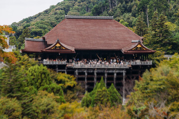 Kiyomizu-dera buddhist temple in Kyoto prefecture, Japan, Higashiyama ward, autumn fall view with mountains, Kyoto streets and skyline, shrine and pagoda, travel to Japan, Kansai region