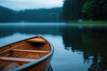 Obraz premium Wooden rowboat lake misty forest morning serenity