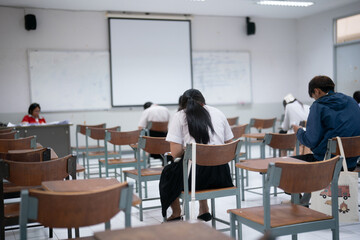University Students Taking an Exam in a Classroom