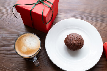 cup of coffee ,chocolate muffın and red gift box