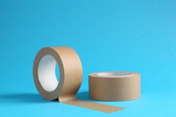 Rolls of masking tapes on light blue background