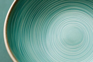 Fototapeta premium Ceramic bowl featuring smooth hand-crafted texture and soft glaze finish against a modern backdrop