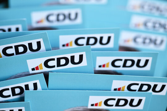 Burgdorf, Lower Saxony, Germany - February 17, 2025: Flyers of The Christian Democratic Union of Germany with the CDU logo - The CDU is a liberal-conservative political party