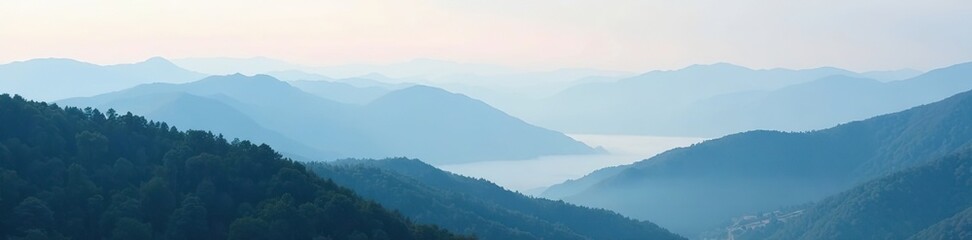 Obraz premium Rolling hills and mountains covered in a thick layer of fog, peaceful, nature