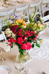Rustic wedding table Setting with floral decoration