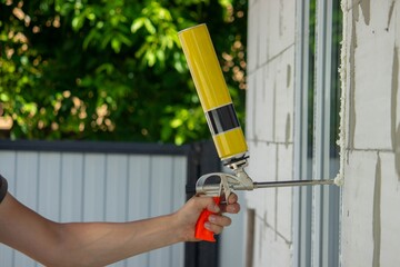 Applying Expanding Foam for Window Installation