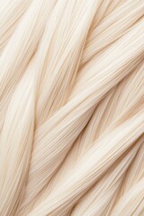 Close-up of shiny, well-maintained blonde hair strands intertwined, exemplifying the importance of proper hair care for vibrant locks