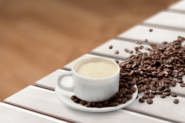 A cup of hot tasty Coffee on wooden table