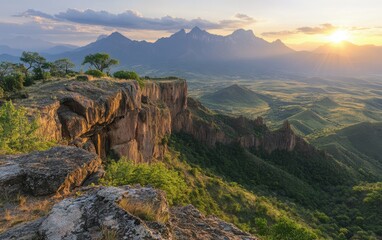 Fototapeta premium Majestic mountains rise against a dramatic sunset, with a steep cliff offering breathtaking views of the vibrant sky and distant horizons.